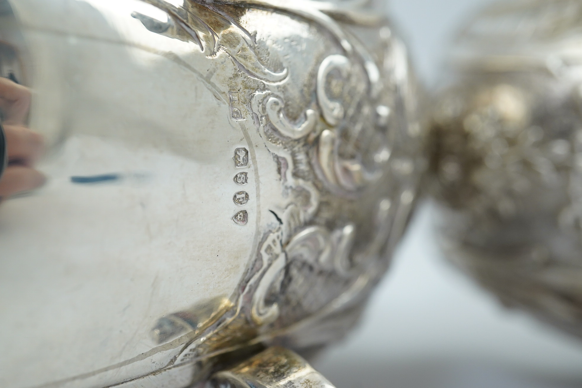 A pair of late 19th century German Hanau ornate embossed silver oval sweetmeat bowls